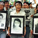 Protesters carry portraits of Chinese journalists killed in NATO’s bombing of the Chinese Embassy in Belgrade, during a demonstration outside the US consulate in Guangzhou, May 10, 1999.